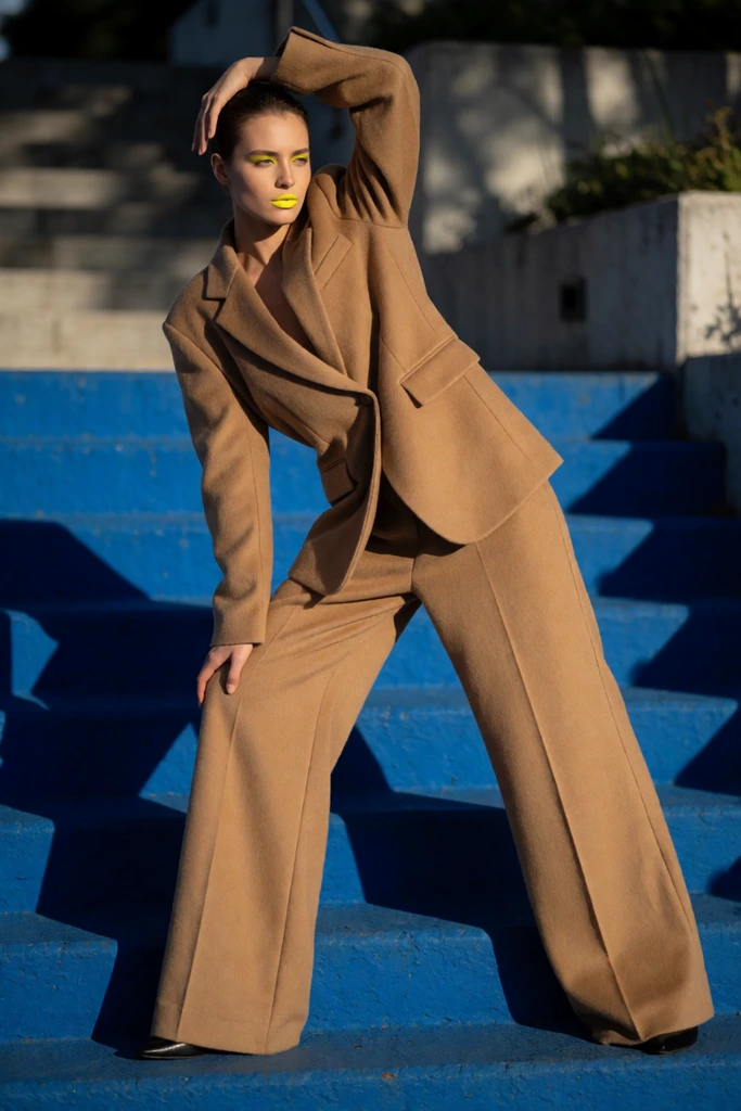 Camel tailoring on cobalt stairs