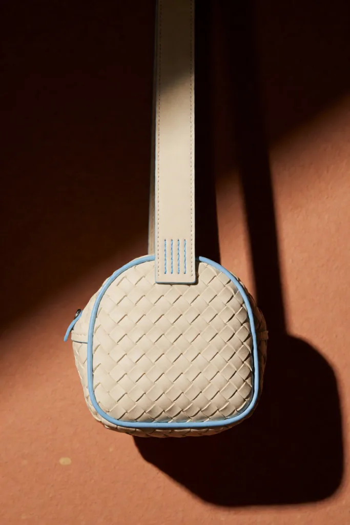 Woven cream mini bag on terracotta