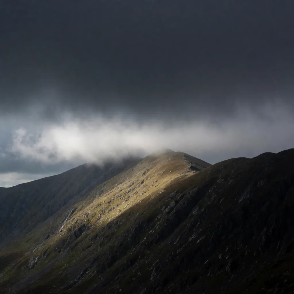 Storm light over ridgeline